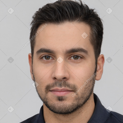 Neutral white young-adult male with short  brown hair and brown eyes