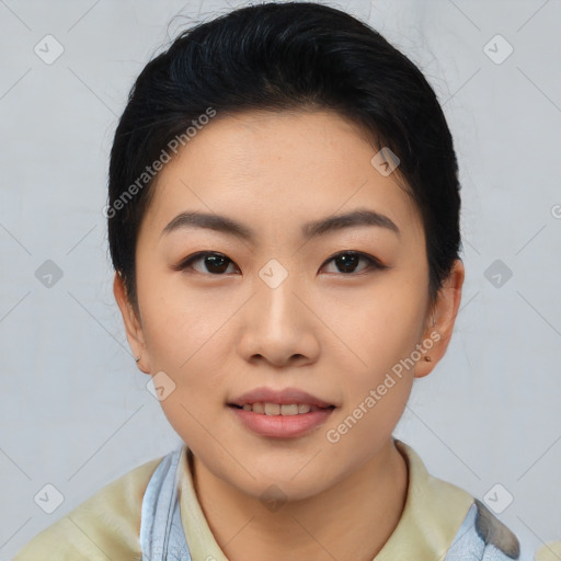 Joyful asian young-adult female with short  black hair and brown eyes