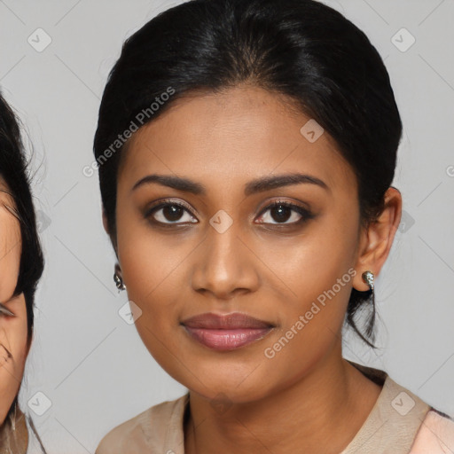 Joyful latino young-adult female with medium  brown hair and brown eyes