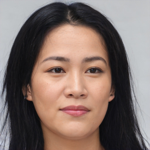 Joyful asian young-adult female with long  brown hair and brown eyes