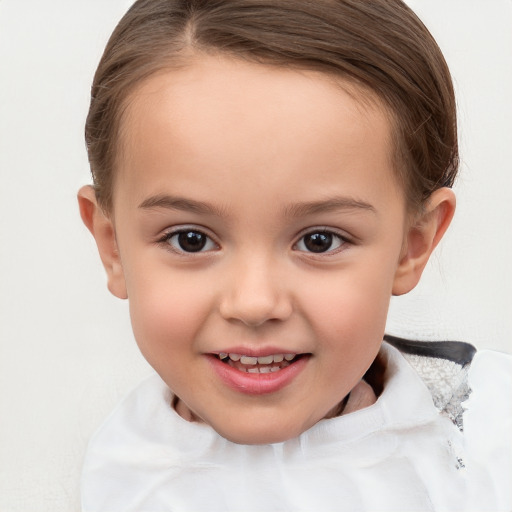 Joyful white child female with short  brown hair and brown eyes