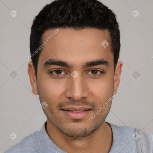 Joyful latino young-adult male with short  black hair and brown eyes