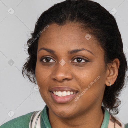 Joyful black young-adult female with medium  brown hair and brown eyes