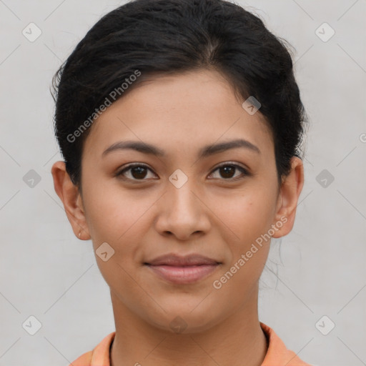 Joyful latino young-adult female with short  brown hair and brown eyes