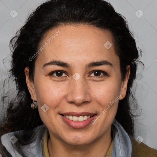 Joyful white adult female with long  brown hair and brown eyes