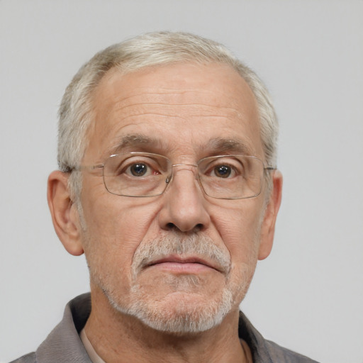 Neutral white middle-aged male with short  gray hair and brown eyes