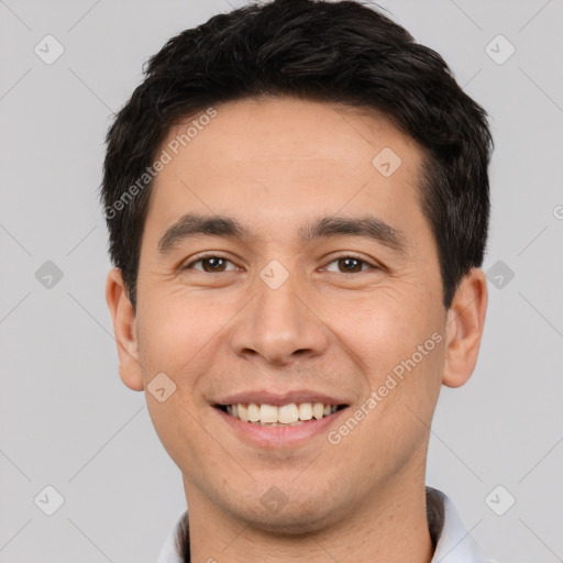 Joyful white young-adult male with short  black hair and brown eyes