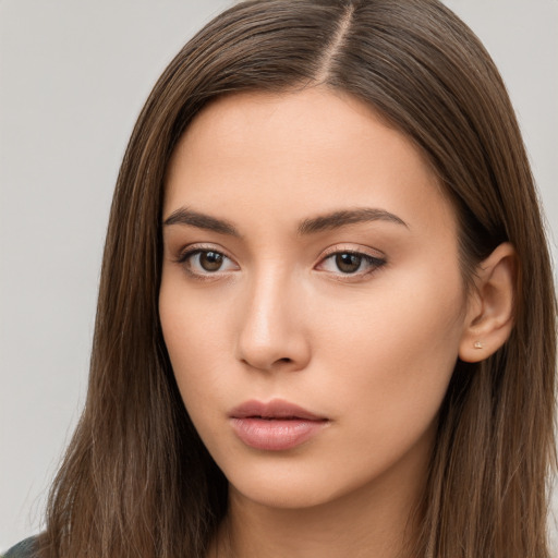 Neutral white young-adult female with long  brown hair and brown eyes