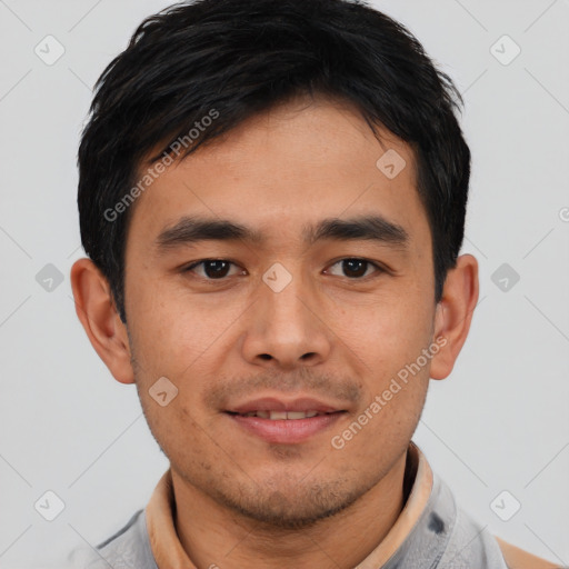 Joyful asian young-adult male with short  brown hair and brown eyes