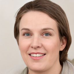 Joyful white young-adult female with medium  brown hair and blue eyes