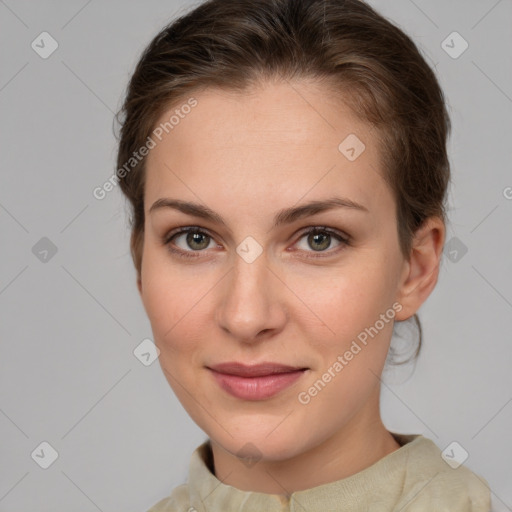 Joyful white young-adult female with medium  brown hair and green eyes