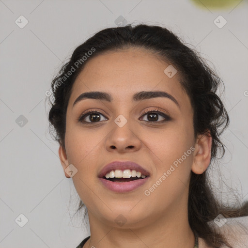 Joyful latino young-adult female with long  black hair and brown eyes