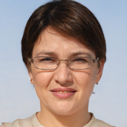 Joyful white adult female with short  brown hair and brown eyes