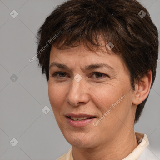 Joyful white adult female with short  brown hair and brown eyes