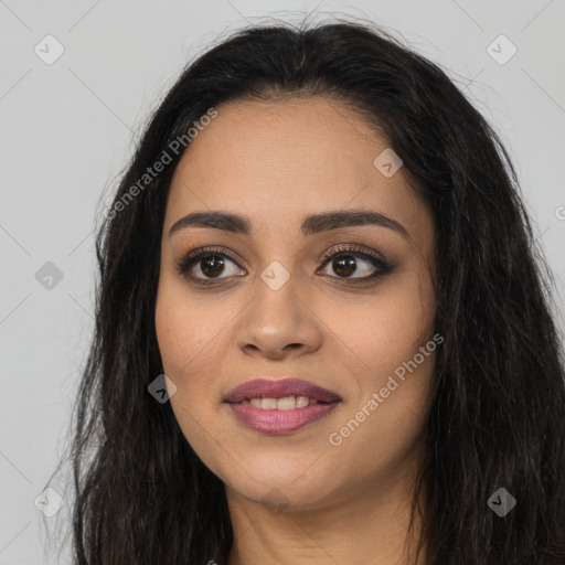 Joyful latino young-adult female with long  brown hair and brown eyes