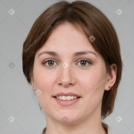 Joyful white young-adult female with medium  brown hair and grey eyes