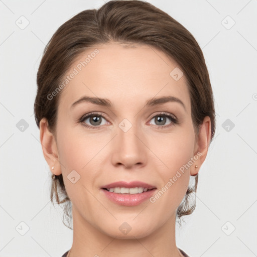 Joyful white young-adult female with medium  brown hair and grey eyes