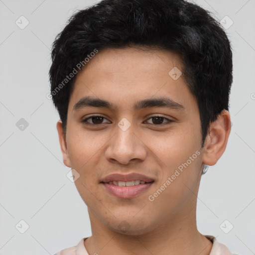 Joyful latino young-adult male with short  brown hair and brown eyes