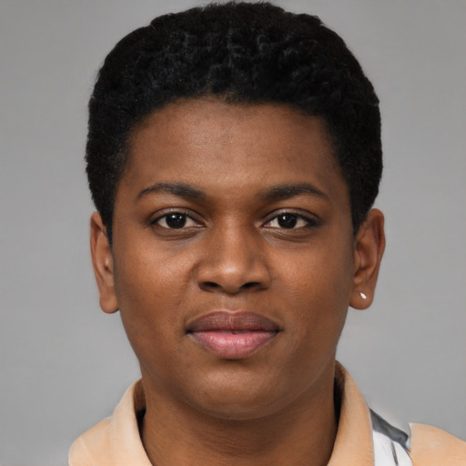 Joyful black young-adult female with short  black hair and brown eyes