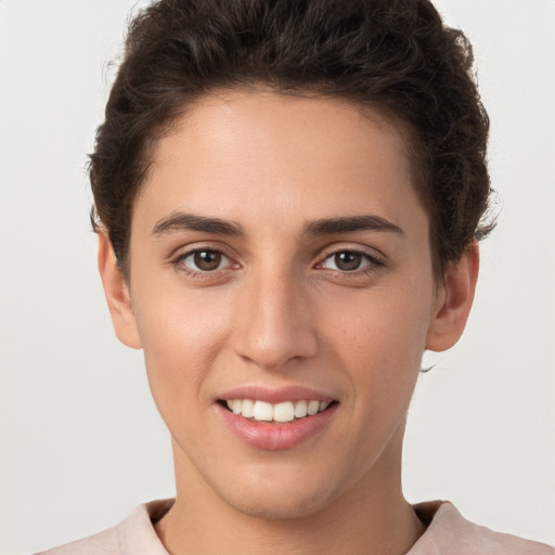 Joyful white young-adult female with short  brown hair and brown eyes