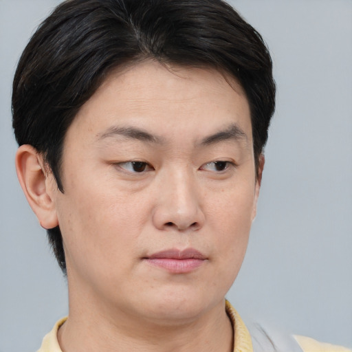 Neutral asian young-adult male with short  brown hair and brown eyes