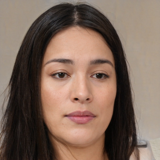 Joyful asian young-adult female with long  brown hair and brown eyes