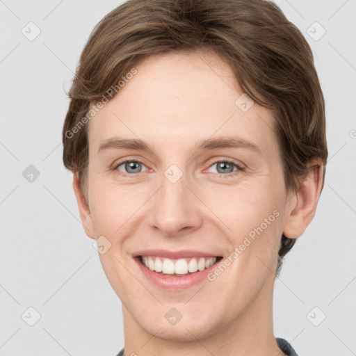 Joyful white young-adult female with short  brown hair and grey eyes