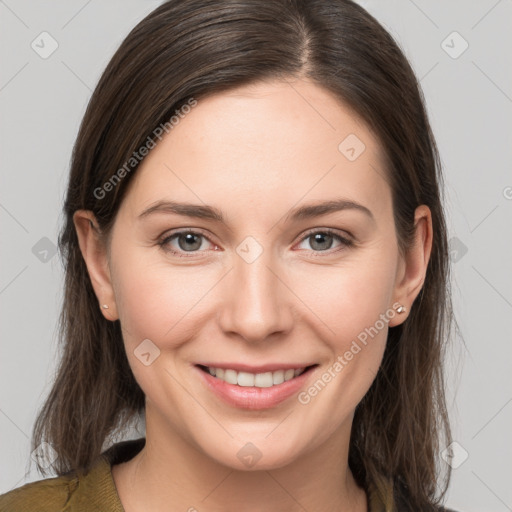 Joyful white young-adult female with medium  brown hair and grey eyes