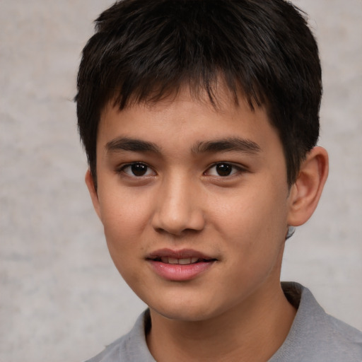 Joyful white child male with short  brown hair and brown eyes