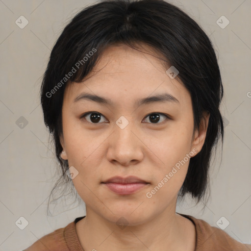 Joyful asian young-adult female with medium  black hair and brown eyes