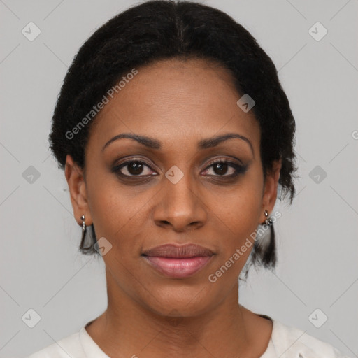 Joyful black young-adult female with short  black hair and brown eyes