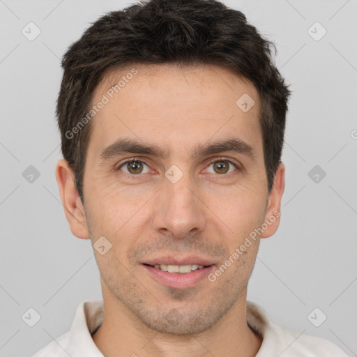 Joyful white young-adult male with short  brown hair and brown eyes