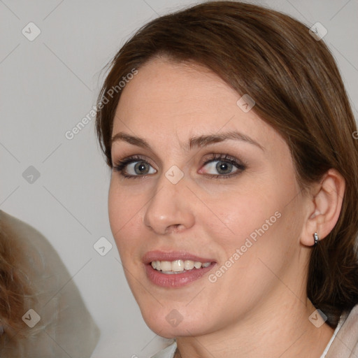 Joyful white young-adult female with medium  brown hair and blue eyes