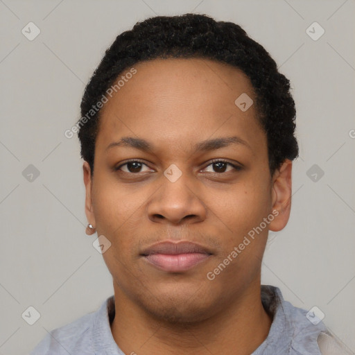 Joyful black young-adult female with short  black hair and brown eyes