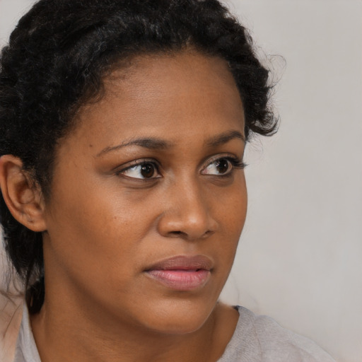 Neutral black young-adult female with short  brown hair and brown eyes