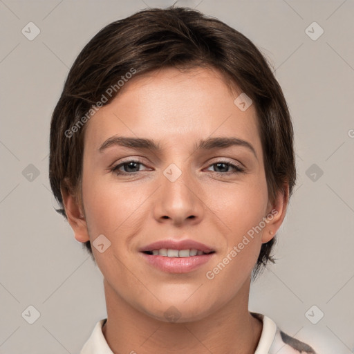 Joyful white young-adult female with short  brown hair and brown eyes