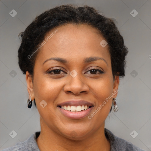 Joyful black adult female with short  brown hair and brown eyes