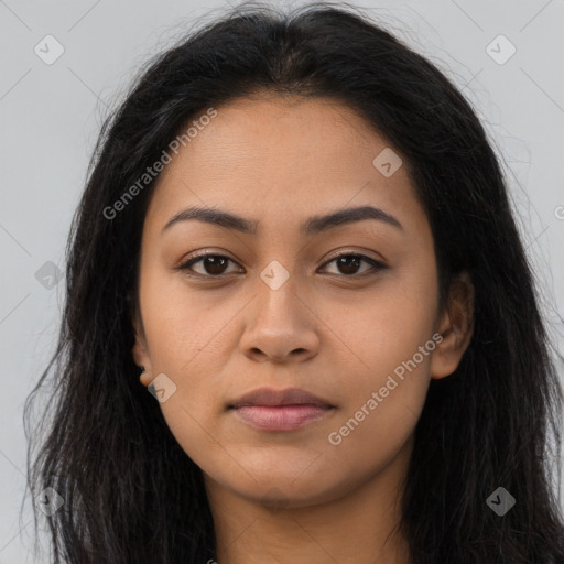 Joyful latino young-adult female with long  brown hair and brown eyes