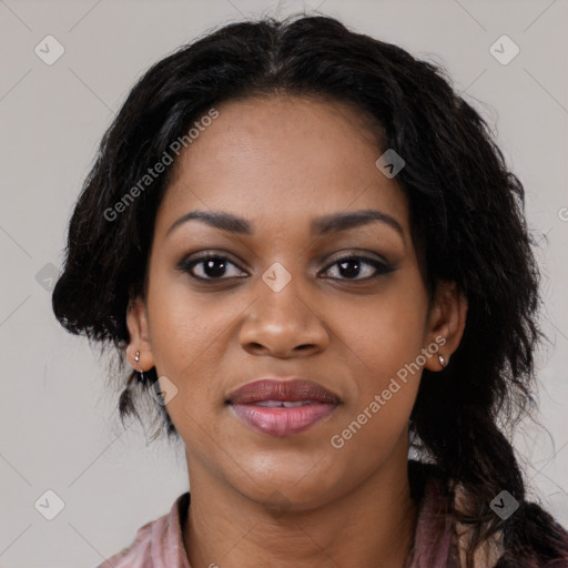 Joyful black young-adult female with long  black hair and brown eyes