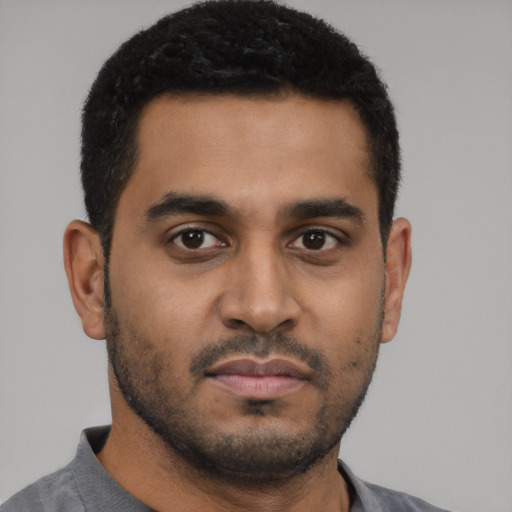 Neutral latino young-adult male with short  black hair and brown eyes