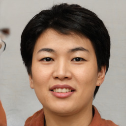 Joyful asian young-adult female with short  brown hair and brown eyes