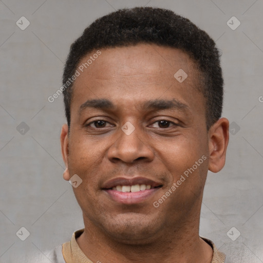 Joyful latino young-adult male with short  brown hair and brown eyes