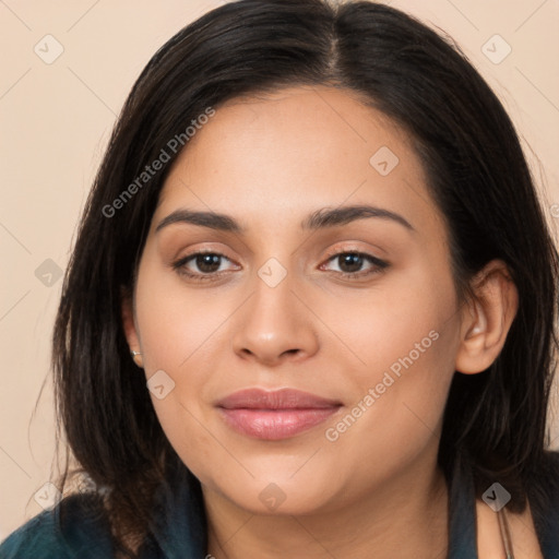 Joyful latino young-adult female with long  brown hair and brown eyes