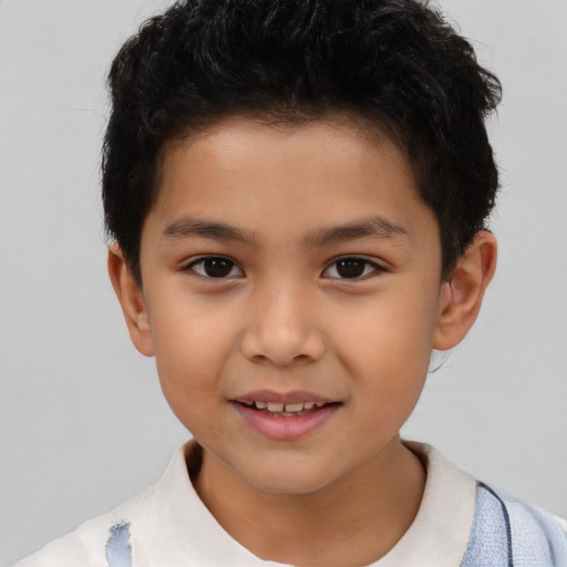 Joyful asian child male with short  brown hair and brown eyes