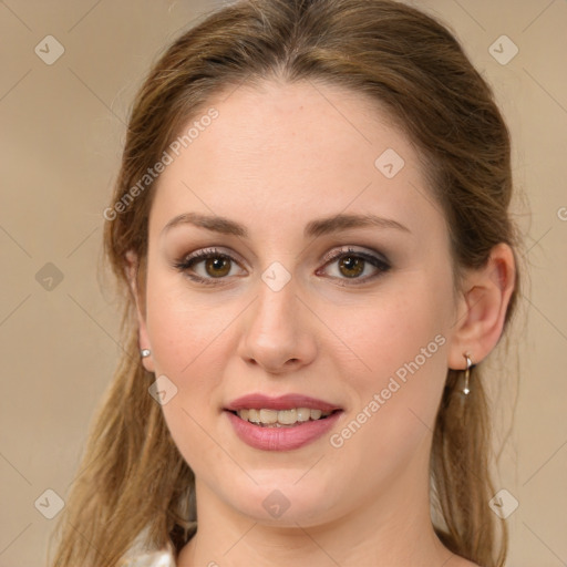 Joyful white young-adult female with long  brown hair and green eyes