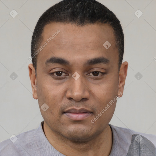 Neutral latino young-adult male with short  black hair and brown eyes