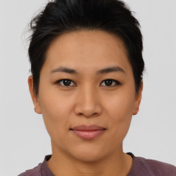 Joyful asian young-adult female with short  brown hair and brown eyes