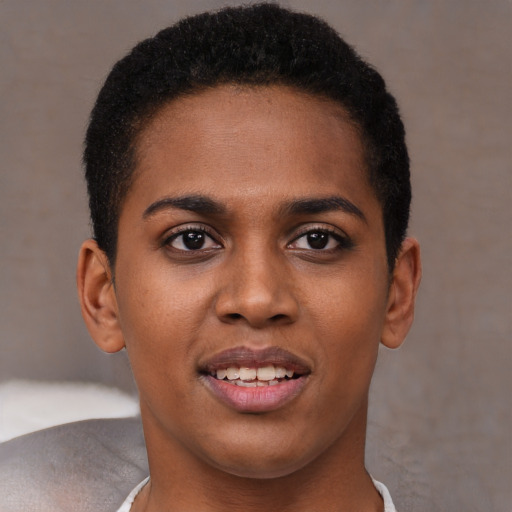 Joyful black young-adult female with short  brown hair and brown eyes