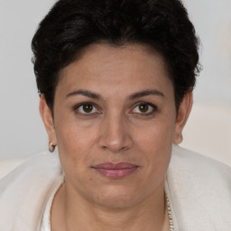 Joyful white adult female with short  brown hair and brown eyes