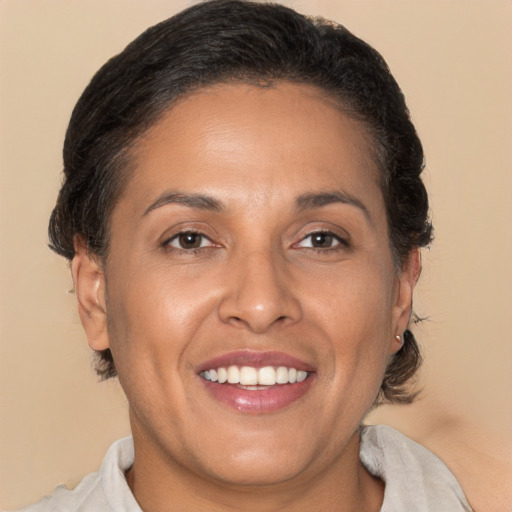 Joyful white adult female with medium  brown hair and brown eyes